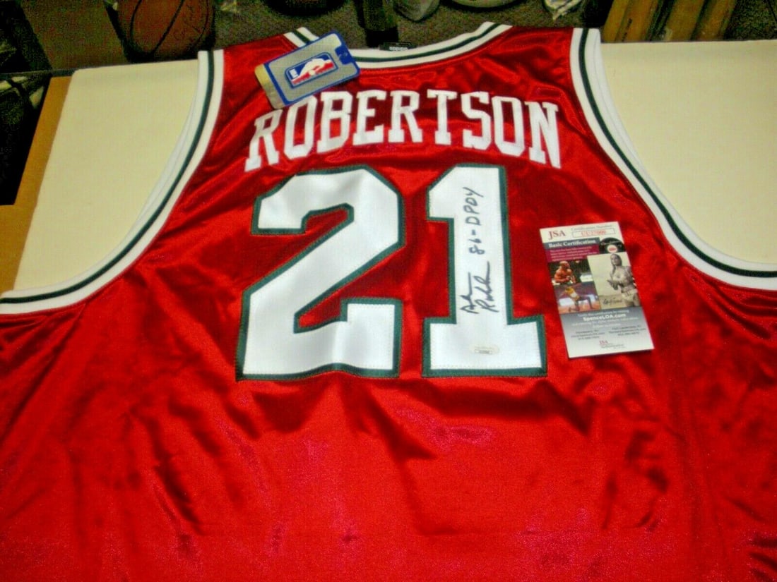 Alvin Robertson 1986 DPOY Signed Adidas Jersey Milwaukee Bucks JSA COA: Alvin Robertson 1986 DPOY Signed Adidas Jersey Milwaukee Bucks JSA COA Celebrate the legacy of Alvin Robertson with this officially licensed Milwaukee Bucks jersey. This pre-owned jersey is a remarkab