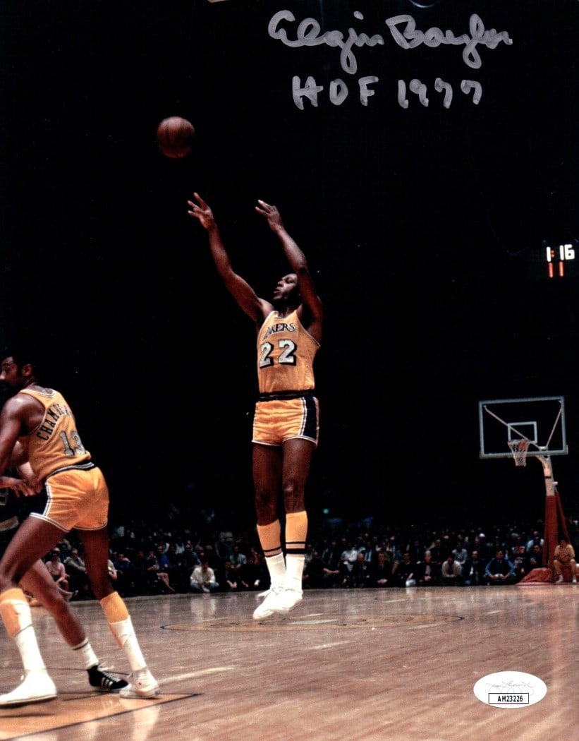 Elgin Baylor Autographed 8x10 Lakers Photo HOF 1977 JSA Authenticated: Elgin Baylor Autographed 8x10 Lakers Photo HOF 1977 JSA Authenticated This is an authentic 8x10 photo of Elgin Baylor captured in a jump shot, showcasing his iconic play for the Los Angeles Lakers. Th