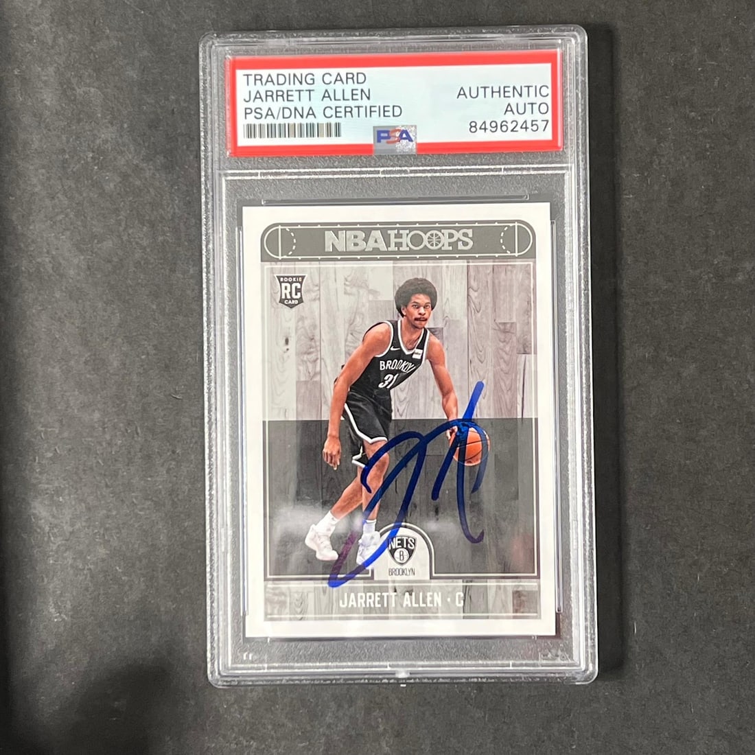 2017-18 NBA Hoops Jarrett Allen Signed Rookie Card PSA Encapsulated: 2017-18 NBA Hoops Jarrett Allen Signed Rookie Card PSA Encapsulated Up for auction is a 2017-18 NBA Hoops #272 card featuring the signature of Jarrett Allen, a promising player from the Brooklyn Nets.