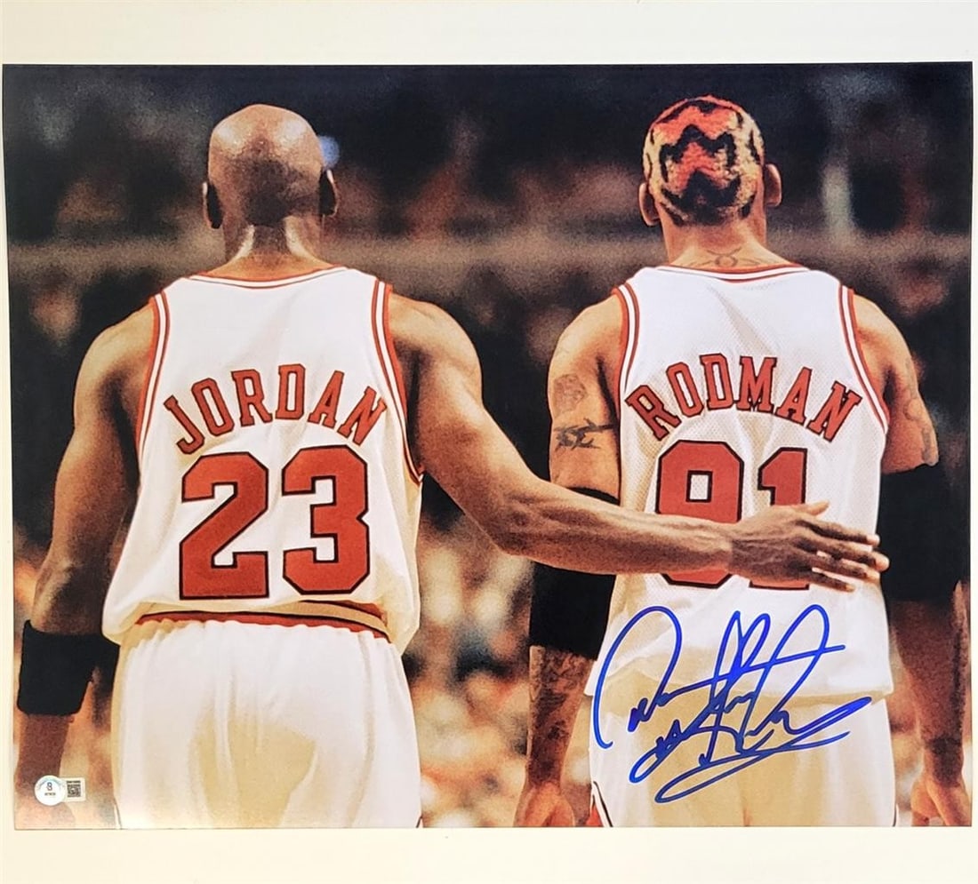 Dennis Rodman Signed 16x20 Photo Chicago Bulls Beckett BAS: Dennis Rodman Signed 16x20 Photo Chicago Bulls Beckett BAS This is an original 16x20 photo featuring Dennis Rodman alongside Michael Jordan, both iconic players of the Chicago Bulls. The photo is sign