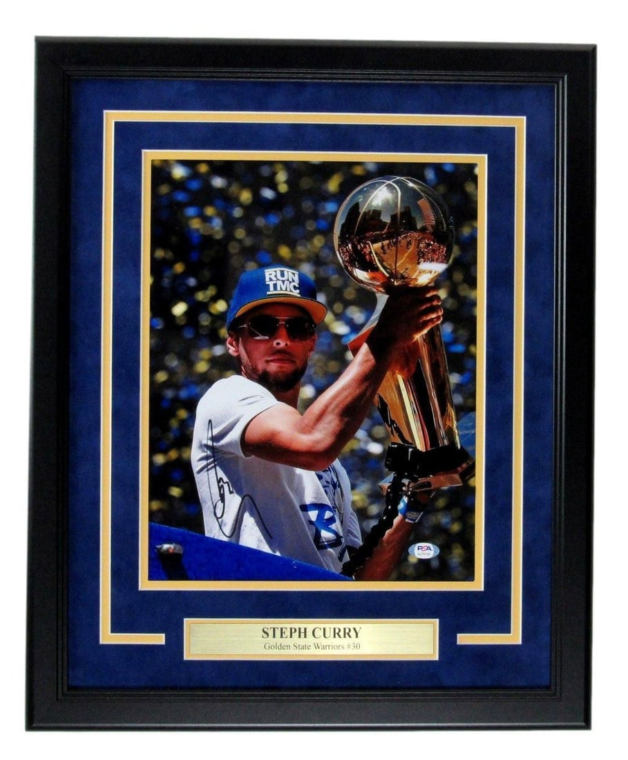 Framed 11x14 Photo Signed by Steph Curry Golden State Warriors PSA/DNA Authenticated: Framed 11x14 Photo Signed by Steph Curry Golden State Warriors PSA/DNA Authenticated This framed 11x14 photo features an authentic autograph from Steph Curry of the Golden State Warriors. The item is 