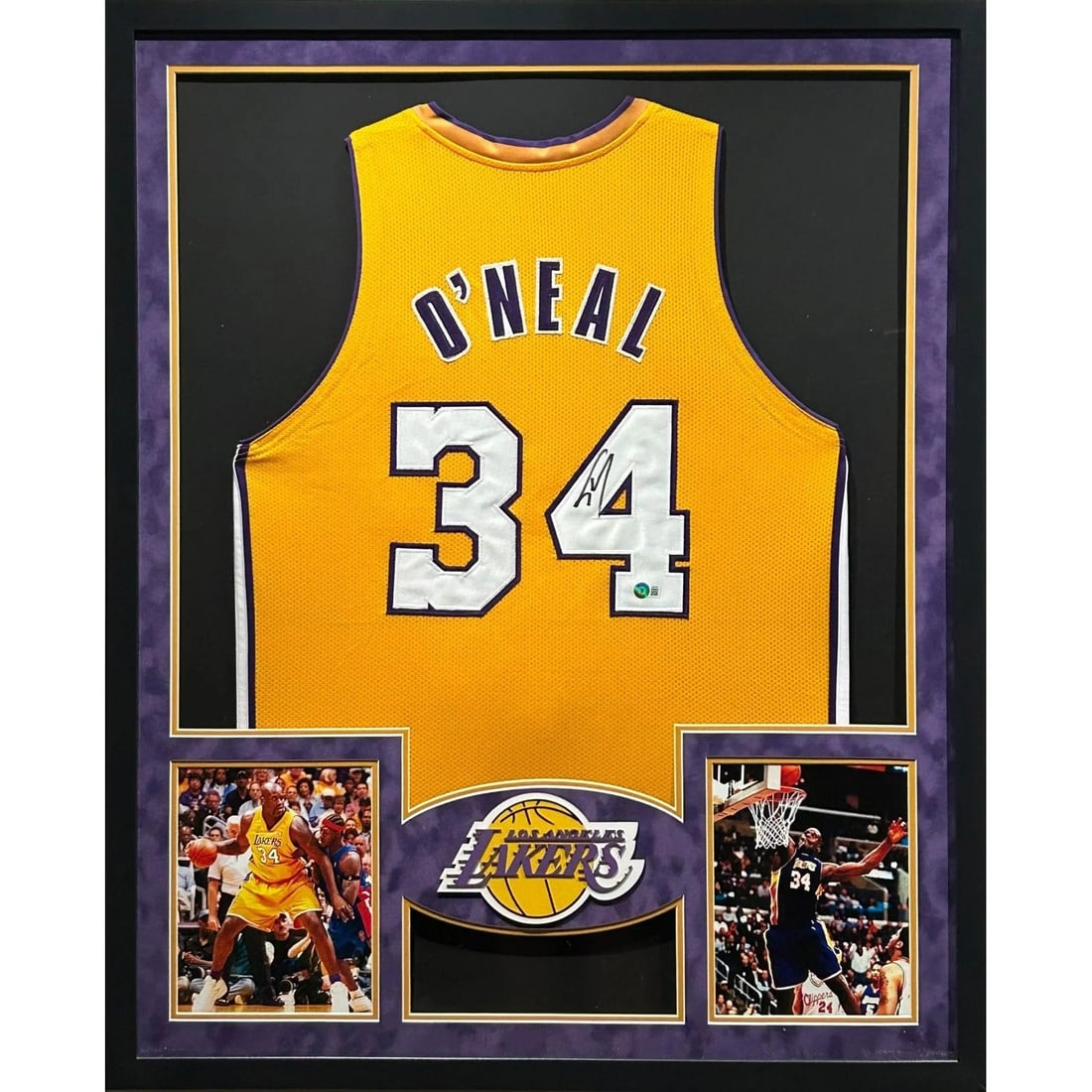 Beckett Authenticated Shaq Framed Lakers Jersey: Beckett Authenticated Shaq Framed Lakers Jersey This framed Los Angeles Lakers jersey has been autographed by Shaquille O'Neal. The jersey is professionally framed with attention to detail and feature