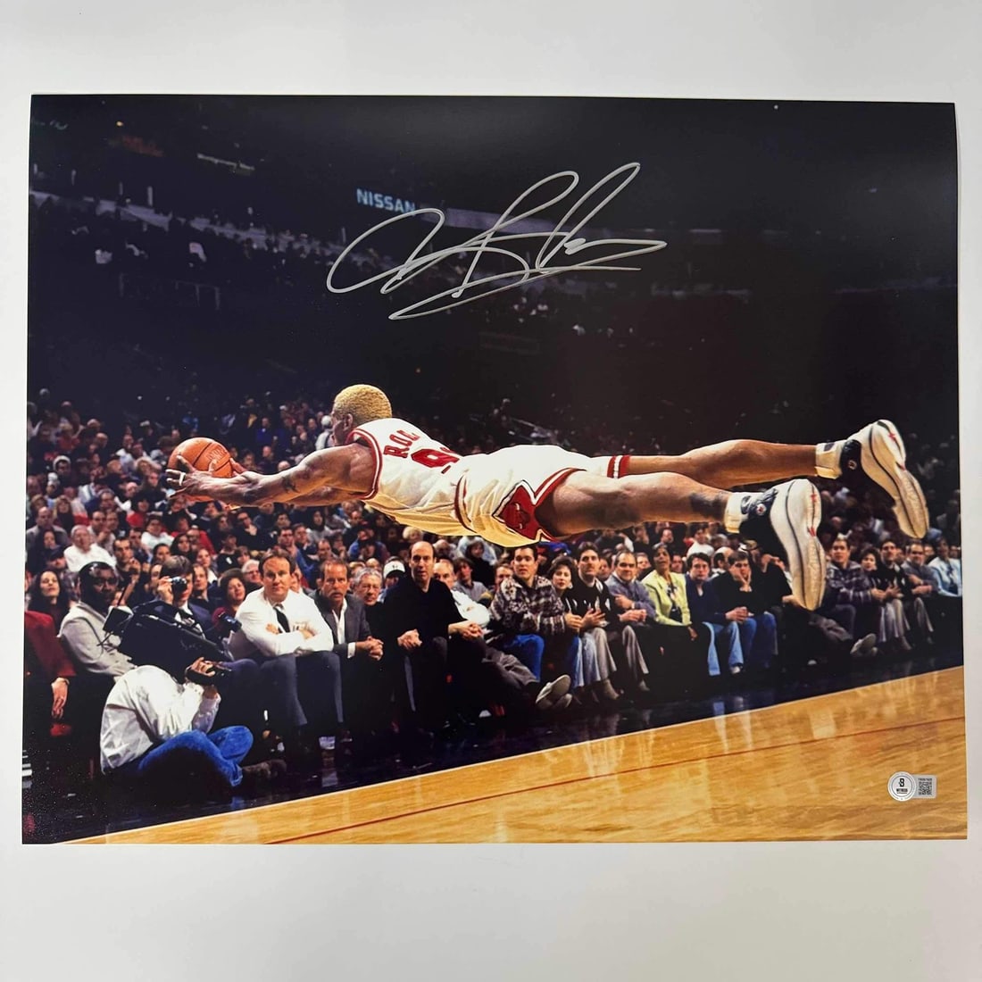 Dennis Rodman Autographed 16x20 Chicago Bulls Photo BAS COA: Dennis Rodman Autographed 16x20 Chicago Bulls Photo BAS COA This authentic Dennis Rodman Chicago Bulls basketball photo measures 16x20 inches and features his autograph. The item is certified by Becke