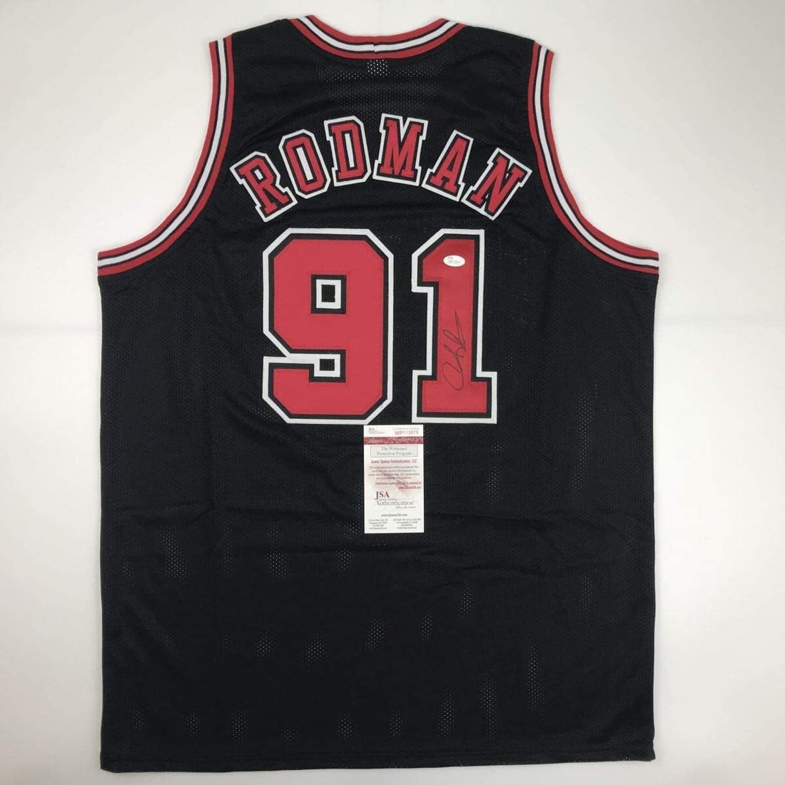 Dennis Rodman Autographed Chicago Bulls Jersey with JSA COA: Dennis Rodman Autographed Chicago Bulls Jersey with JSA COA Celebrate the legacy of Dennis Rodman with this autographed Chicago Bulls black basketball jersey. This custom jersey features Rodman's name