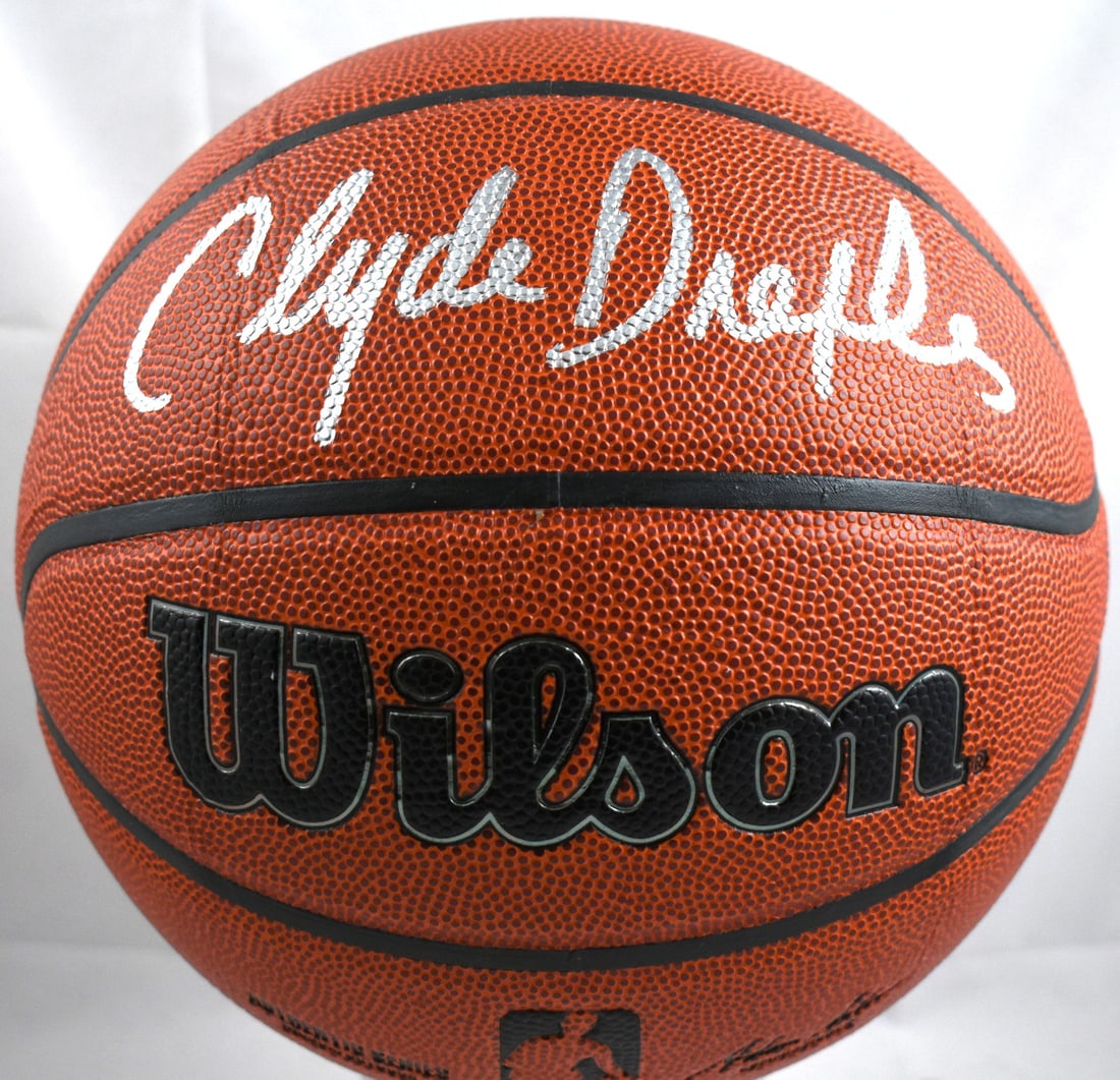 Clyde Drexler Signed Wilson NBA Basketball with Beckett Witness Hologram: Clyde Drexler Signed Wilson NBA Basketball with Beckett Witness Hologram This is an authentic NBA Wilson basketball autographed by Clyde Drexler. The ball is an original item associated with the Houst