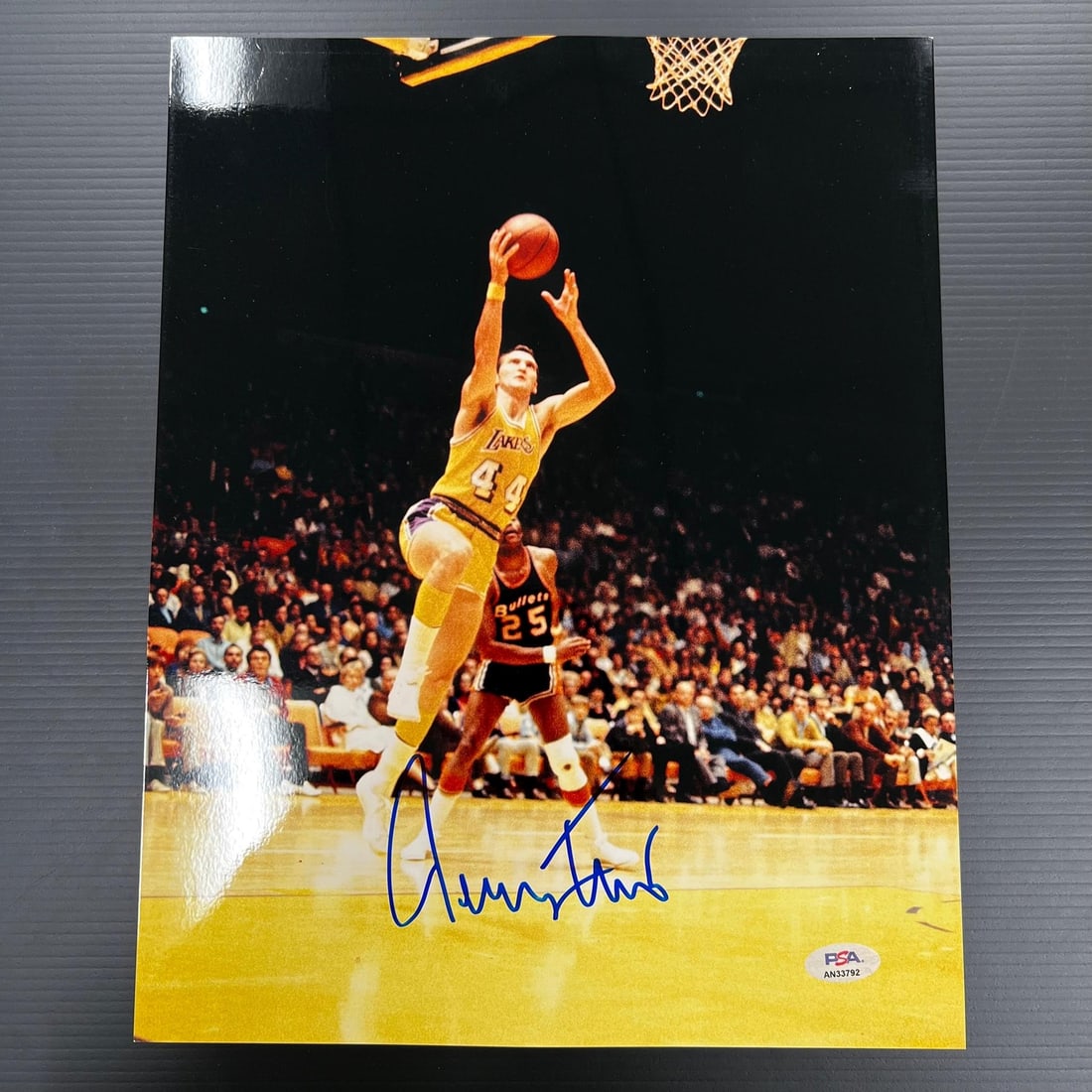 PSA DNA authenticated Jerry West signed 11x14 basketball photo: PSA DNA authenticated Jerry West signed 11x14 basketball photo This is an original 11x14 professionally printed photograph autographed by Jerry West, the legendary basketball player for the Los Angele