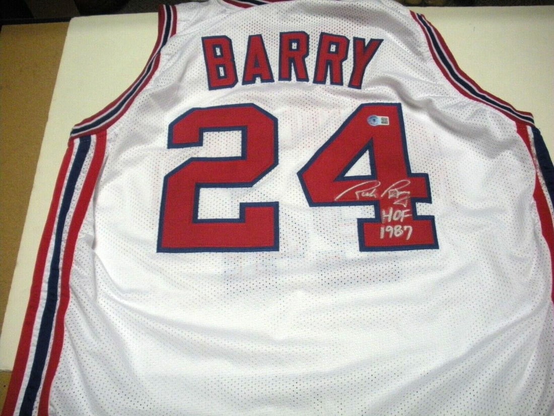 Rick Barry Autographed Basketball Jersey with JSA COA: Rick Barry Autographed Basketball Jersey with JSA COA This is a pre-owned jersey signed by Rick Barry, featuring his association with the Miami Hurricanes and the Golden State Warriors. The jersey is 