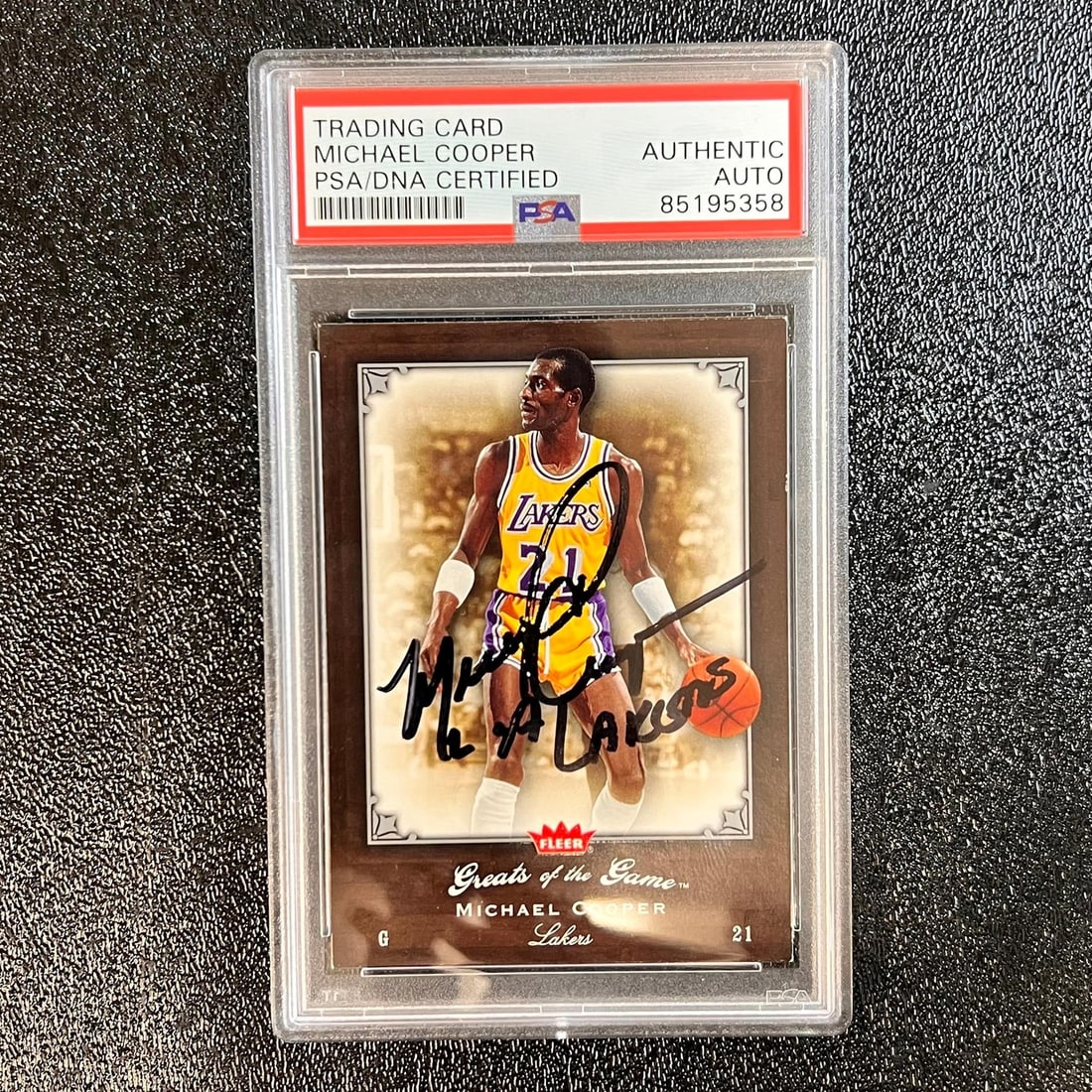 Michael Cooper Autographed Fleer Greats Card PSA Authenticated Slab 2005-06: Michael Cooper Autographed Fleer Greats Card PSA Authenticated Slab 2005-06 This is a 2005-06 Fleer Greats of the Game #35 trading card signed by Michael Cooper, who is known for his career with the L