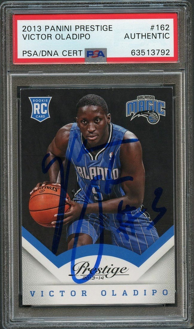 2013 Panini Prestige Victor Oladipo Signed Rookie Card PSA/DNA Authenticated: 2013 Panini Prestige Victor Oladipo Signed Rookie Card PSA/DNA Authenticated This is a 2013 Panini Prestige Rookie Card #162, featuring a signature from Victor Oladipo, who is known for his time with 