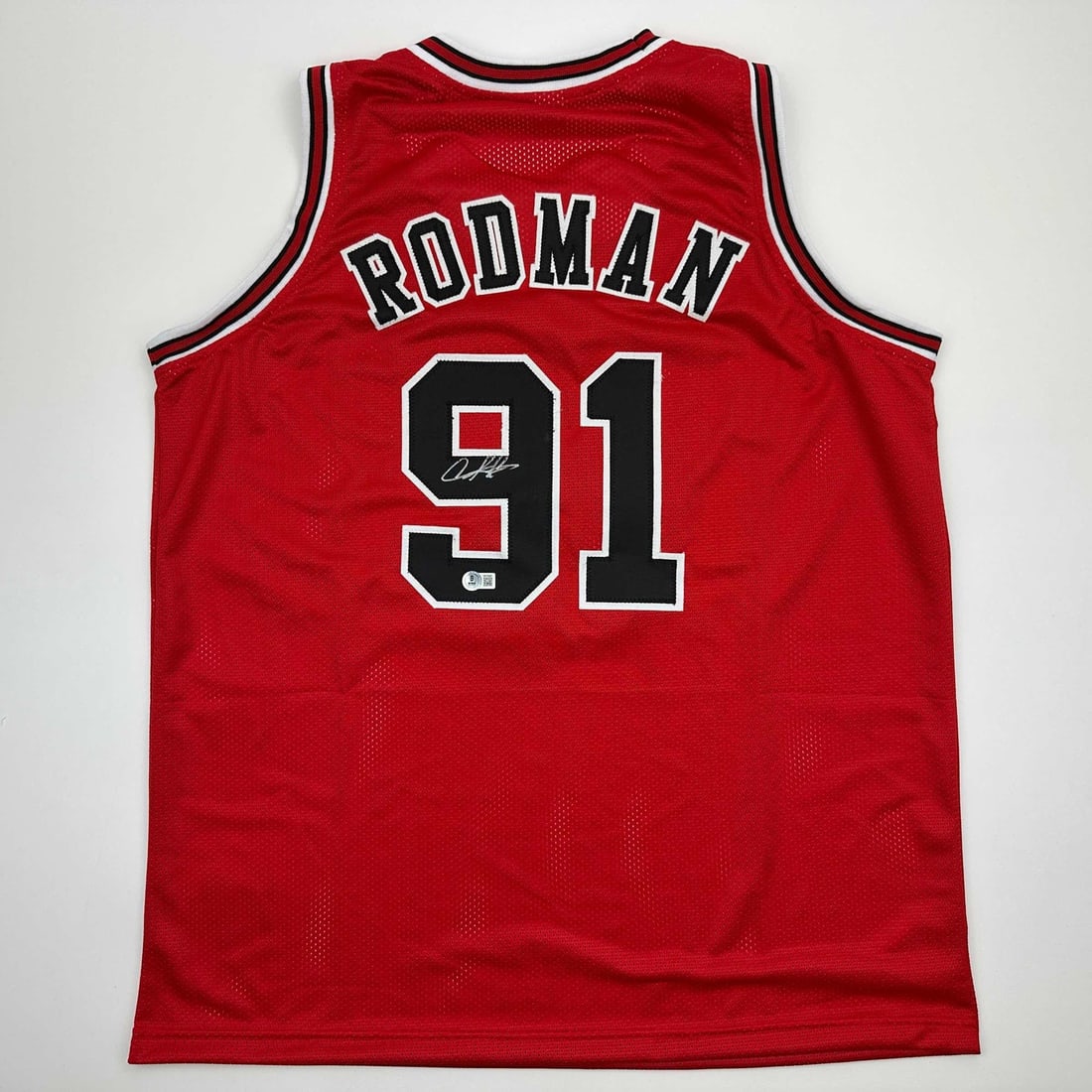 Dennis Rodman Autographed Chicago Bulls Jersey Beckett BAS COA Gem Mint: Dennis Rodman Autographed Chicago Bulls Jersey Beckett BAS COA Gem Mint Celebrate the legacy of Dennis Rodman with this autographed Chicago Bulls red basketball jersey. This custom jersey features Rod