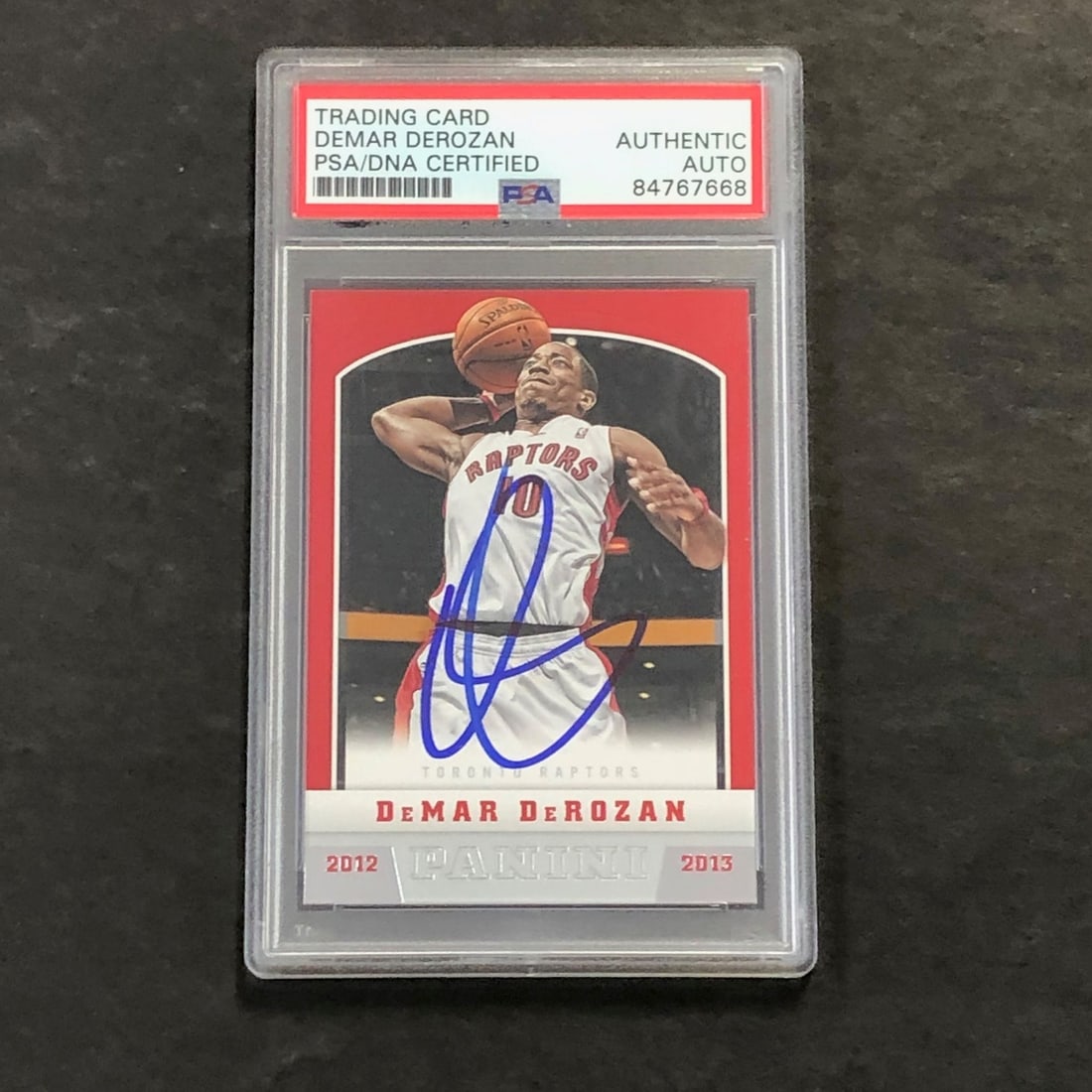 2012-13 Panini #45 DeMar DeRozan Signed Card PSA Authenticated Raptors: 2012-13 Panini #45 DeMar DeRozan Signed Card PSA Authenticated Raptors This 2012-13 Panini #45 card features an authentic signature from DeMar DeRozan, who is recognized for his time with the Toronto 