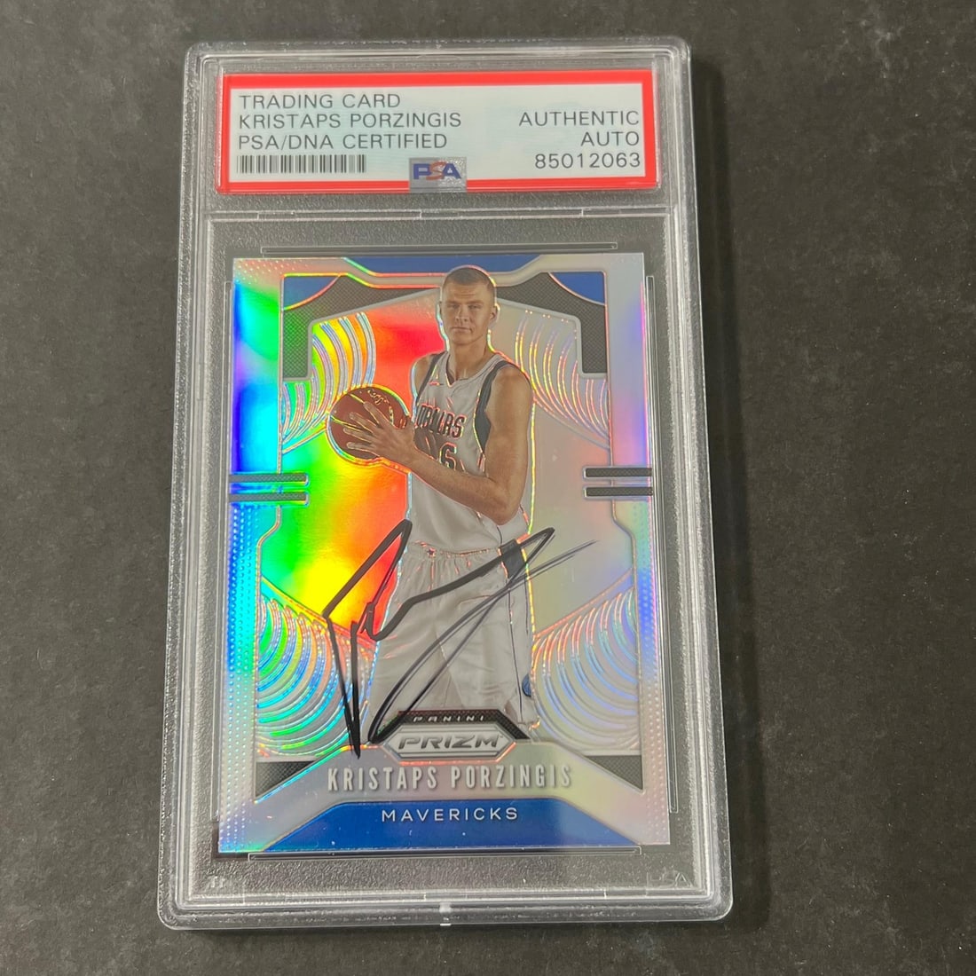 Kristaps Porzingis Signed 2019-20 Prizm Card PSA Authenticated #76: Kristaps Porzingis Signed 2019-20 Prizm Card PSA Authenticated #76 This is a 2019-20 Panini Prizm #76 trading card featuring Kristaps Porzingis. The card has been signed by Kristaps Porzingis and auth