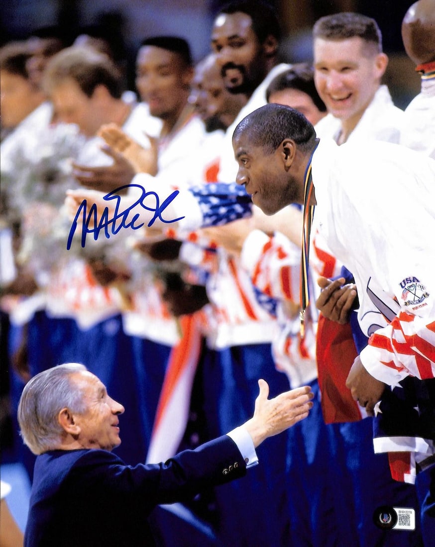11x14 Magic Johnson USA Olympic basketball photo Beckett authenticated: 11x14 Magic Johnson USA Olympic basketball photo Beckett authenticated This 11x14 photograph features basketball legend Magic Johnson as a member of the USA Olympic Basketball team. The photo is hand-