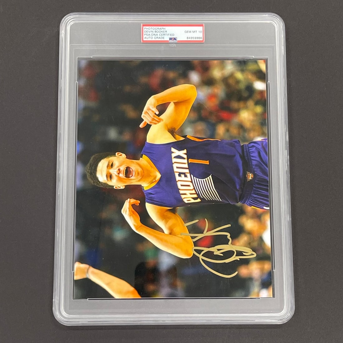 Devin Booker Signed 8x10 Photo PSA/DNA Authenticated Phoenix Suns: Devin Booker Signed 8x10 Photo PSA/DNA Authenticated Phoenix Suns This is an original 8x10 photograph of Devin Booker, a star player for the Phoenix Suns, expertly signed by him. The autograph has bee