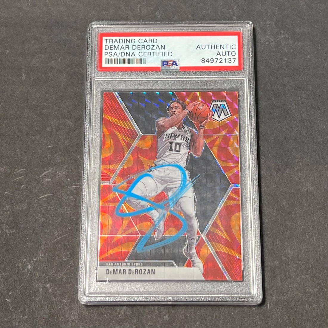 2019-20 Panini Mosaic #184 DeMar DeRozan Signed PSA Authenticated Spurs Card: 2019-20 Panini Mosaic #184 DeMar DeRozan Signed PSA Authenticated Spurs Card This listing features a 2019-20 Panini Mosaic #184 trading card signed by DeMar DeRozan, who is known for his time with the