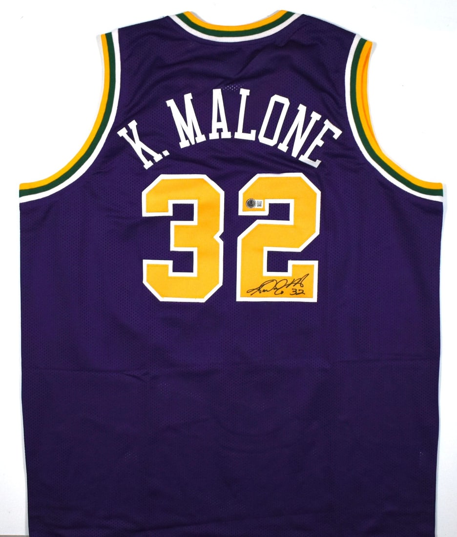 Karl Malone signed Utah Jazz purple pro style jersey Beckett hologram: Karl Malone signed Utah Jazz purple pro style jersey Beckett hologram This is a purple pro style jersey autographed by Karl Malone. The jersey represents the Utah Jazz and comes with a Beckett W holog