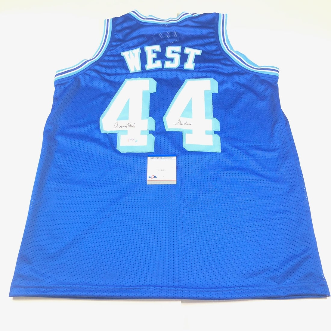 Autographed Jerry West Lakers jersey PSA DNA inscribed THE LOGO: Autographed Jerry West Lakers jersey PSA DNA inscribed THE LOGO This is a stitched Los Angeles Lakers jersey autographed and inscribed "THE LOGO" by basketball legend Jerry West. The signature has bee