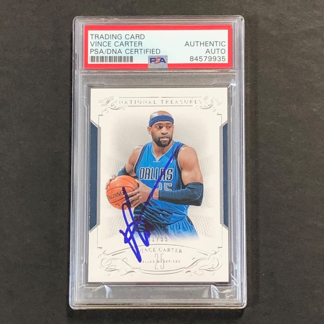 Vince Carter autographed Panini National Treasures 25 PSA DNA slab: Vince Carter autographed Panini National Treasures 25 PSA DNA slab This is a 2013-14 Panini National Treasures #25 sports trading card featuring Vince Carter of the Dallas Mavericks. The card is autog