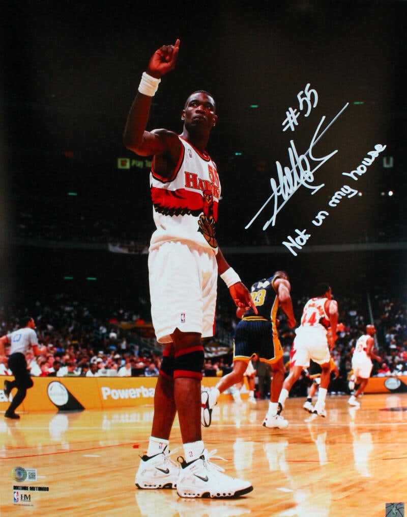 Dikembe Mutombo Signed 16x20 Atlanta Hawks Photo with Inscription Beckett Authenticated: Dikembe Mutombo Signed 16x20 Atlanta Hawks Photo with Inscription Beckett Authenticated This is an original 16x20 photograph of Dikembe Mutombo, featuring his signature along with an inscription. The 