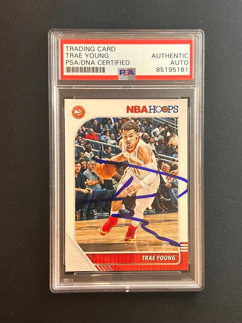 Trae Young Rookie Autograph Card Panini Hoops 2018-19 PSA Authenticated Hawks: Trae Young Rookie Autograph Card Panini Hoops 2018-19 PSA Authenticated Hawks This is a 2018-19 Panini Hoops #1 rookie card featuring Trae Young of the Atlanta Hawks. The card has been autographed by 