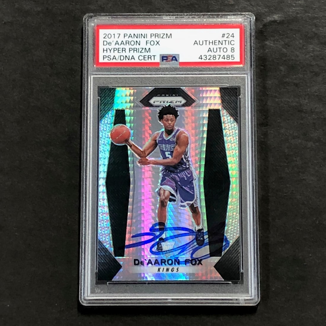 2017-18 Panini Hyper Prizm De'Aaron Fox Signed Auto PSA 8: 2017-18 Panini Hyper Prizm De'Aaron Fox Signed Auto PSA 8 Presenting the 2017-18 Panini Hyper Prizm #24 sports trading card featuring De'Aaron Fox of the Sacramento Kings. This card showcases a vibran