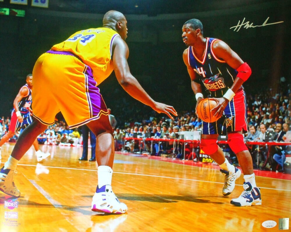Hakeem Olajuwon signed Houston Rockets 16x20 photo JSA Silver: Hakeem Olajuwon signed Houston Rockets 16x20 photo JSA Silver This 16x20 photograph features Hakeem Olajuwon of the Houston Rockets in action against Shaquille O'Neal. The photo is autographed by Hake