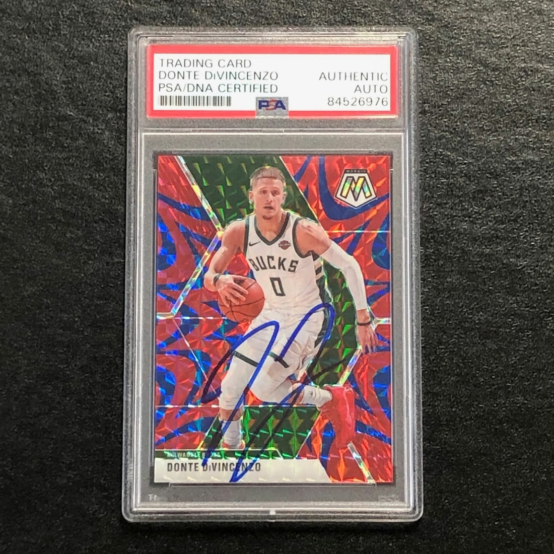2019 Mosaic Blue Reactive #135 Donte DiVincenzo Signed Card PSA/DNA: 2019 Mosaic Blue Reactive #135 Donte DiVincenzo Signed Card PSA/DNA This 2019 Mosaic Blue Reactive #135 card features the signature of Donte DiVincenzo, a notable player for the Milwaukee Bucks. The a