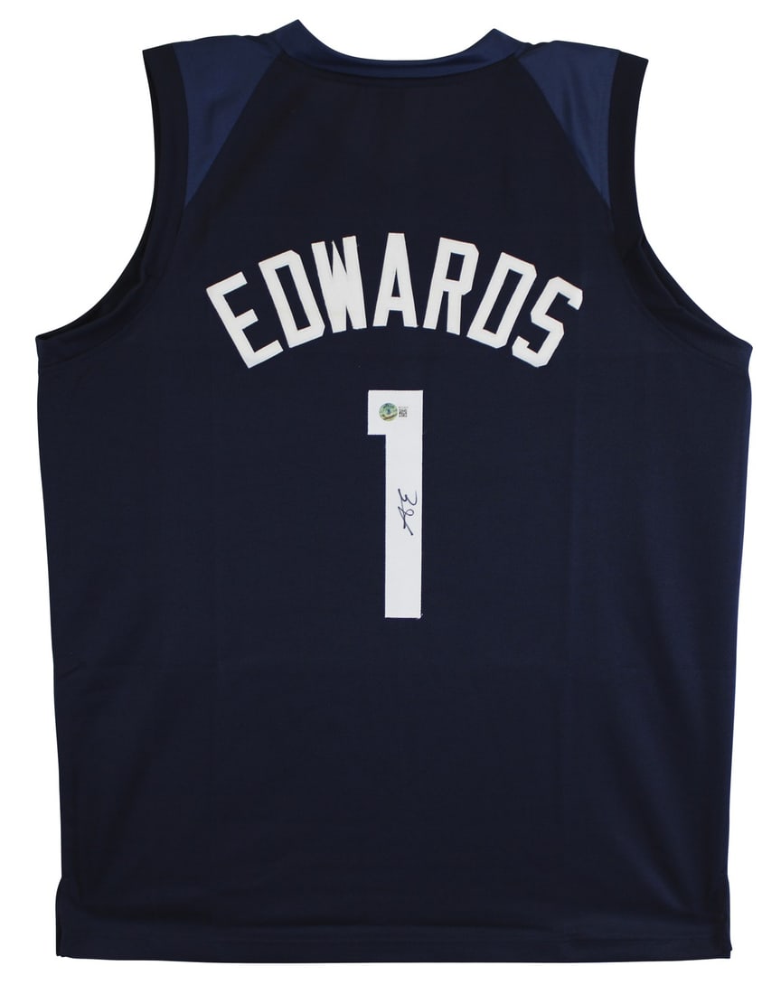 Autographed Anthony Edwards Navy Pro Style Jersey Beckett Authenticated: Autographed Anthony Edwards Navy Pro Style Jersey Beckett Authenticated This navy blue pro style jersey has been personally autographed by Anthony Edwards of the Minnesota Timberwolves. The jersey is 
