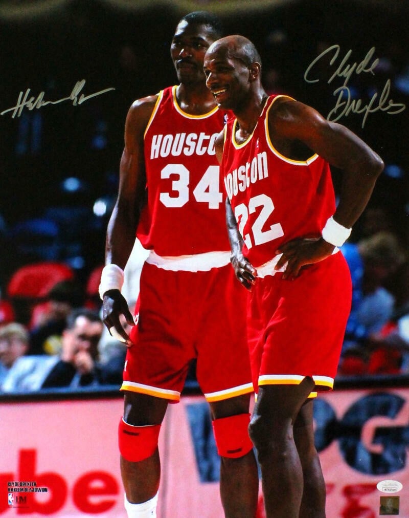 Houston Rockets 16x20 autographed photo by Drexler and Olajuwon JSA: Houston Rockets 16x20 autographed photo by Drexler and Olajuwon JSA This 16x20 red jersey photo features autographs from Clyde Drexler and Hakeem Olajuwon of the Houston Rockets. The photo is an origi