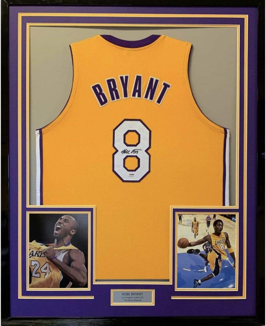 Framed Kobe Bryant Autographed Lakers Jersey 33x42 PSA COA: Framed Kobe Bryant Autographed Lakers Jersey 33x42 PSA COA This is a professionally framed and autographed Kobe Bryant jersey, measuring 33" x 42". The jersey features the vibrant yellow color of the 