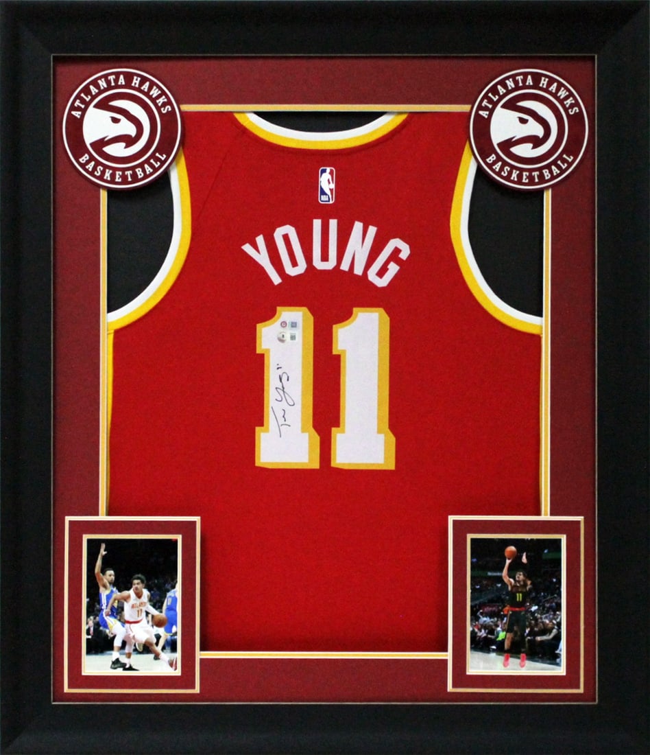 Trae Young Signed Red Nike Swingman Framed Jersey BAS: Trae Young Signed Red Nike Swingman Framed Jersey BAS This authentic red Nike Swingman jersey is personally signed by Trae Young, the standout player for the Atlanta Hawks. The jersey is framed profes
