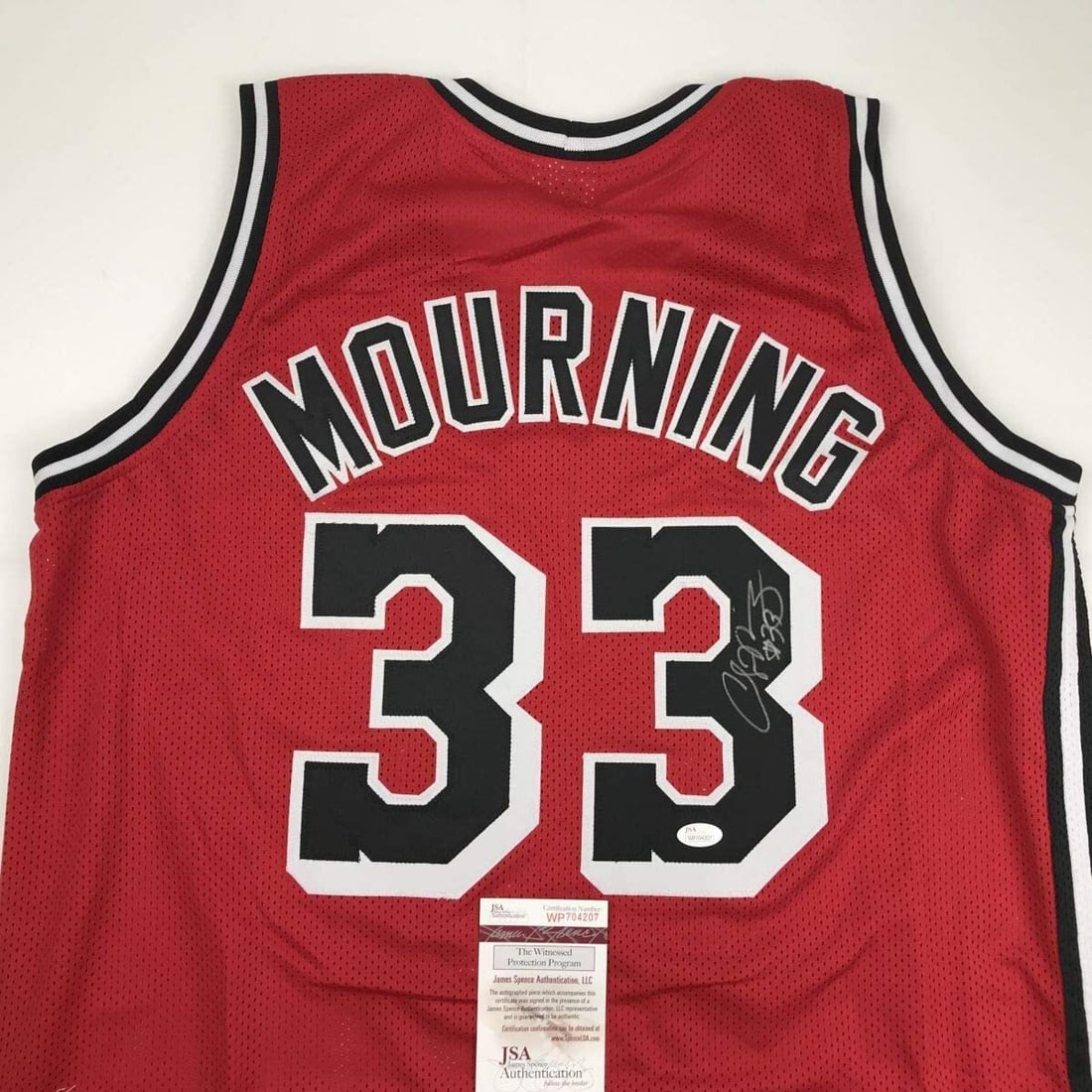 Alonzo Mourning Signed Miami Heat Basketball Jersey JSA COA: Alonzo Mourning Signed Miami Heat Basketball Jersey JSA COA This autographed Alonzo Mourning Miami Red Basketball Jersey is a must-have for any collector. Authenticated by James Spence Authentication 