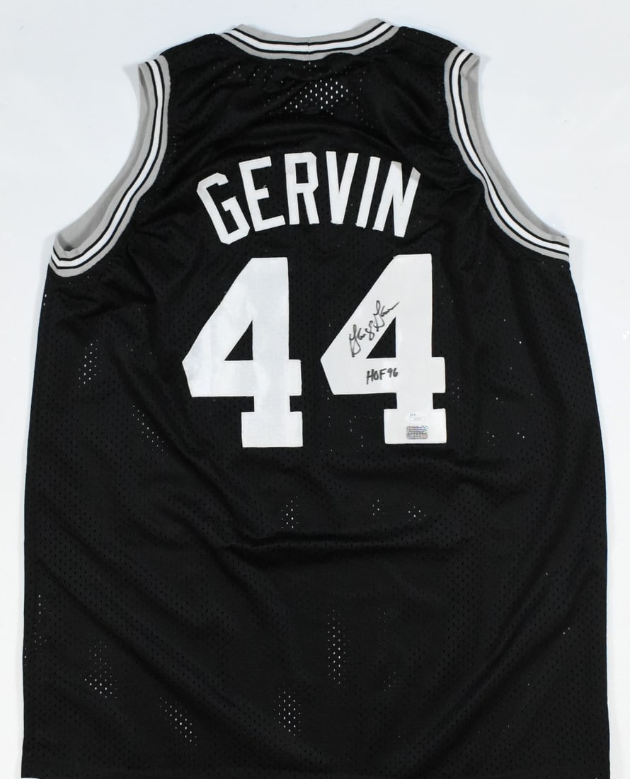 Signed George Gervin Black Pro Jersey With Hall Of Fame Inscription JSA Authenticated: Signed George Gervin Black Pro Jersey With Hall Of Fame Inscription JSA Authenticated This is a black pro style jersey autographed by George Gervin, featuring his Hall of Fame inscription. The jersey 