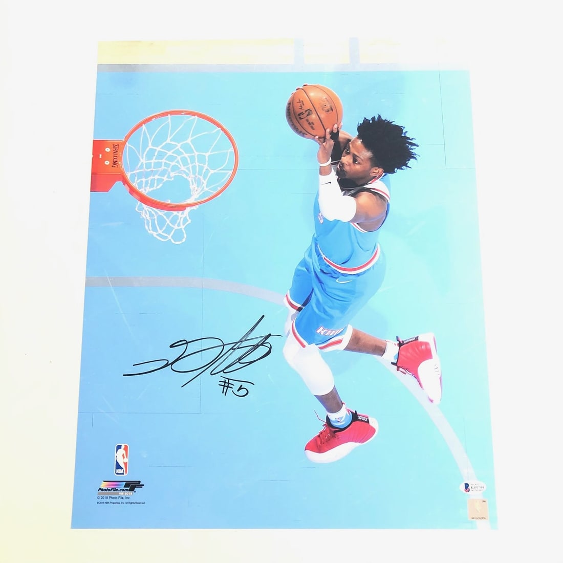 De'Aaron Fox Autographed 16x20 Photo BAS Certified Sacramento Kings: De'Aaron Fox Autographed 16x20 Photo BAS Certified Sacramento Kings This is a professionally printed 16x20 photograph featuring De'Aaron Fox of the Sacramento Kings, showcasing his autograph. The sign
