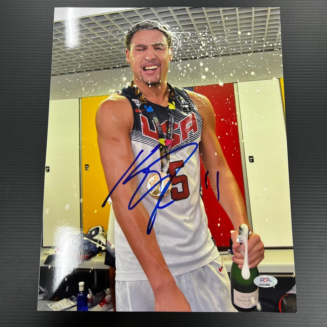 Klay Thompson Autographed 11x14 USA Basketball Photograph PSA/DNA Authenticated: Klay Thompson Autographed 11x14 USA Basketball Photograph PSA/DNA Authenticated This is an original 11x14 professionally printed photograph featuring Klay Thompson of the Golden State Warriors and USA
