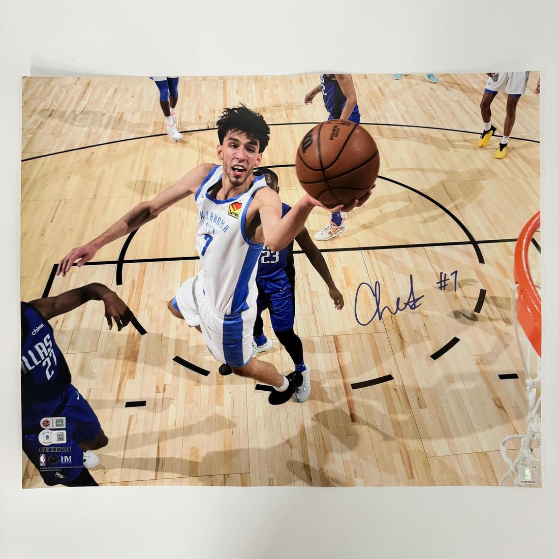Chet Holmgren Autographed OKC Thunder 16x20 Photo Beckett COA: Chet Holmgren Autographed OKC Thunder 16x20 Photo Beckett COA This is an autographed 16x20 basketball photo of Chet Holmgren, a player for the Oklahoma City Thunder. The authenticity of the autograph 