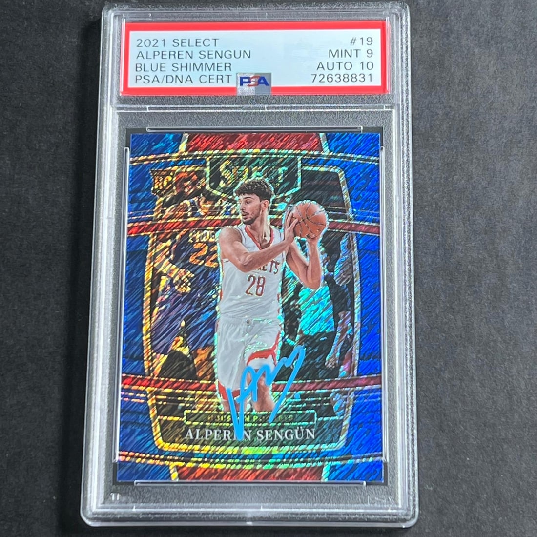 2021-22 Panini Select Blue Shimmer Alperen Sengun Auto 10 PSA 9: 2021-22 Panini Select Blue Shimmer Alperen Sengun Auto 10 PSA 9 Up for auction is the 2021-22 Panini Select Blue Shimmer #19 Alperen Sengun card featuring the Houston Rockets. This collectible card ha