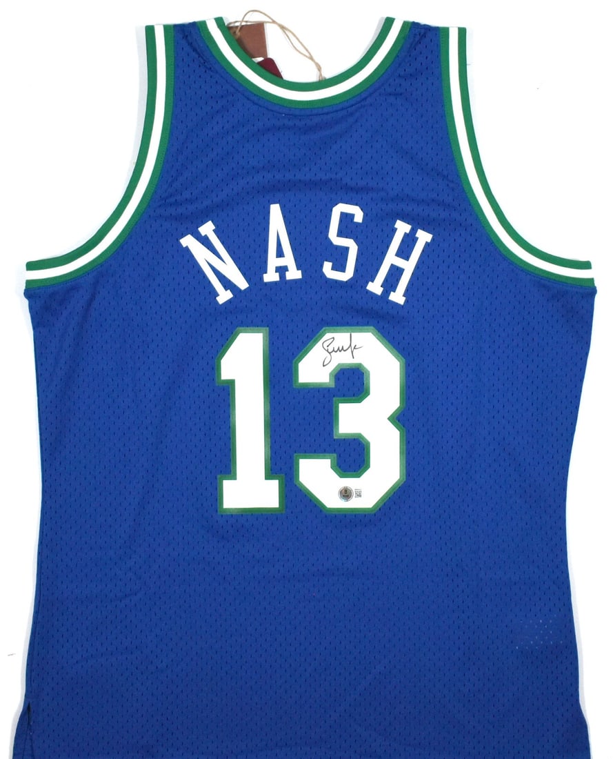 Dallas Mavericks Blue Swingman Jersey Signed by Steve Nash Beckett Hologram: Dallas Mavericks Blue Swingman Jersey Signed by Steve Nash Beckett Hologram This pre-owned Dallas Mavericks Mitchell & Ness Swingman jersey is signed by Steve Nash. The jersey features the team's clas