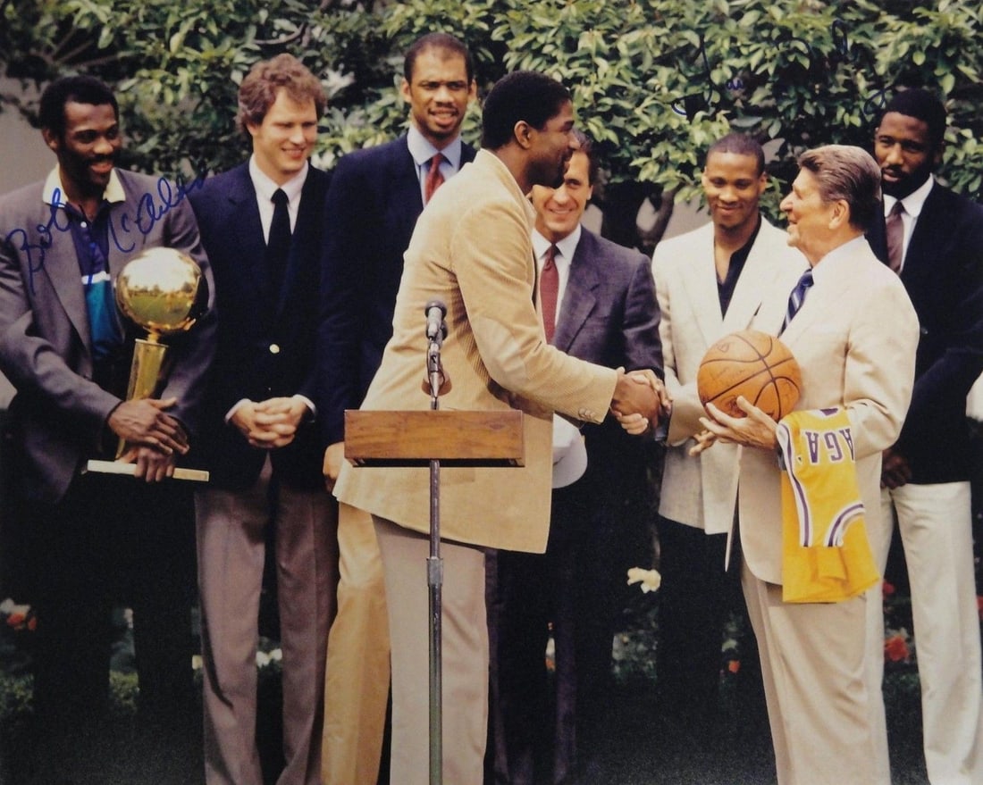 16x20 Photo Signed by Bob McAdoo and James Worthy with Hall Of Fame Sports Auth: 16x20 Photo Signed by Bob McAdoo and James Worthy with Hall Of Fame Sports Auth This 16x20 photograph features the authentic signatures of basketball legends Bob McAdoo and James Worthy. The item is a