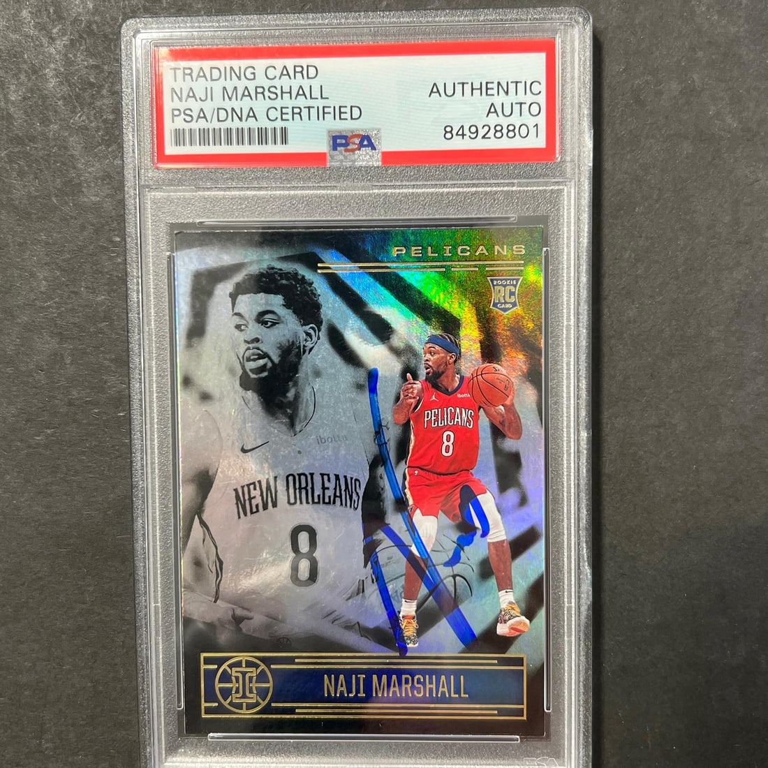 2020-21 Panini Illusions Naji Marshall Signed Card PSA Authenticated: 2020-21 Panini Illusions Naji Marshall Signed Card PSA Authenticated This is a 2020-21 Panini Illusions #197 signed card of Naji Marshall, who played for the New Orleans Pelicans. The card features a 