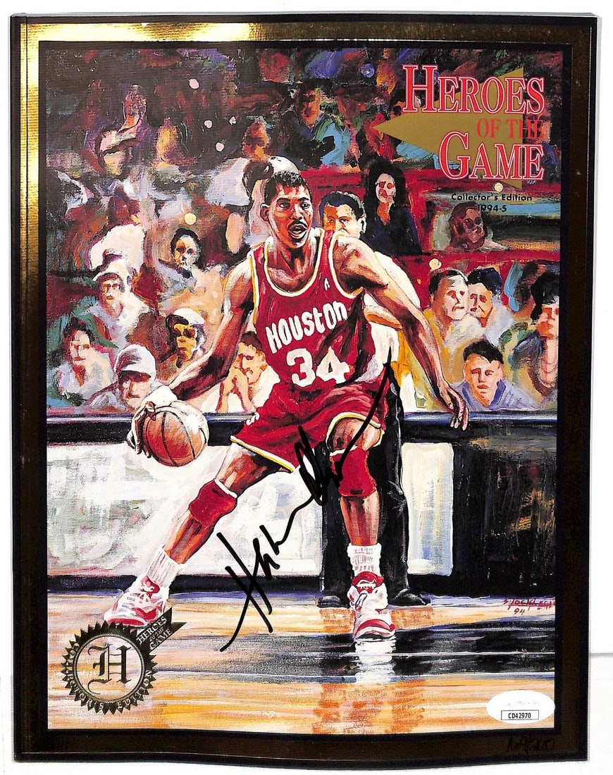 Hakeem Olajuwon Signed 1994 Heroes of the Game Magazine JSA Houston Rockets: Hakeem Olajuwon Signed 1994 Heroes of the Game Magazine JSA Houston Rockets This is an original autographed magazine featuring Hakeem Olajuwon, a celebrated basketball player known for his outstanding