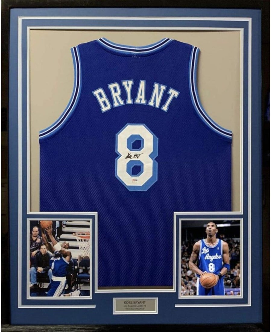 Framed Kobe Bryant Autographed Los Angeles Lakers Jersey PSA/DNA COA: Framed Kobe Bryant Autographed Los Angeles Lakers Jersey PSA/DNA COA This stunning framed display features an authentic autographed Kobe Bryant jersey, measuring 33" x 42". The jersey, representing th