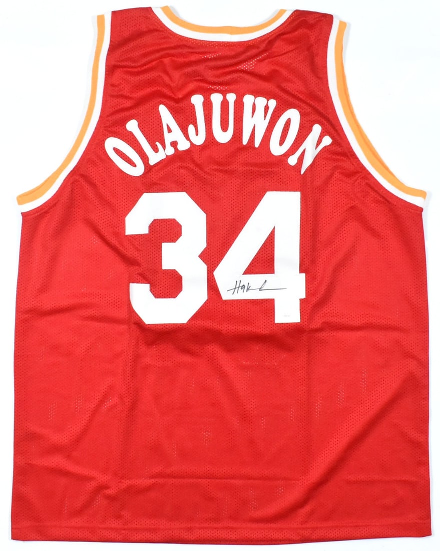 Hakeem Olajuwon Signed Houston Rockets Red Pro Style Jersey JSA: Hakeem Olajuwon Signed Houston Rockets Red Pro Style Jersey JSA This red pro style jersey features the autograph of Hakeem Olajuwon and represents the Houston Rockets. The jersey is an original item a