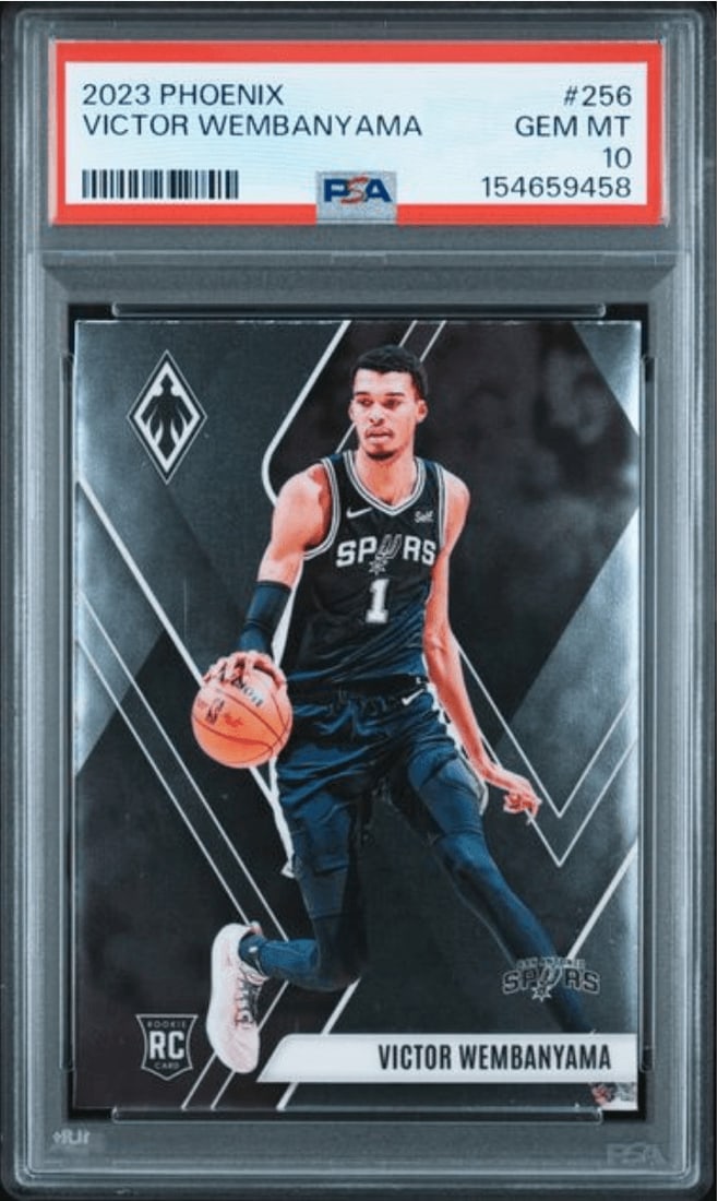 PSA 10 Victor Wembanyama 2023 Panini Phoenix Rookie Card #256: PSA 10 Victor Wembanyama 2023 Panini Phoenix Rookie Card #256 This is a 2023 Panini Phoenix Victor Wembanyama #256 rookie sports trading card, graded PSA 10. The card features Victor Wembanyama of the