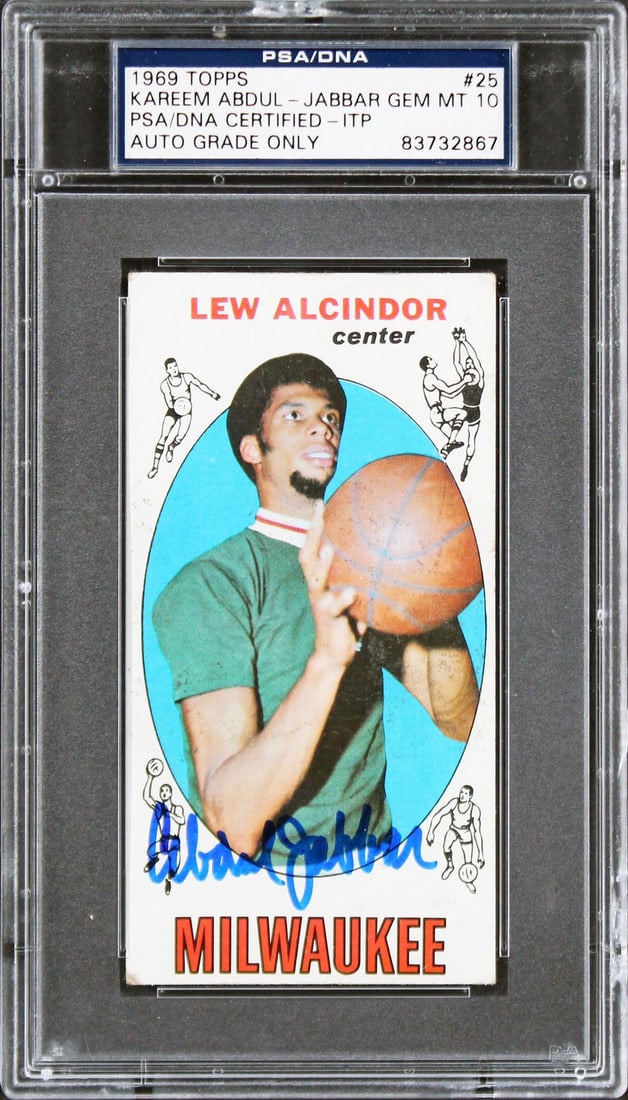 Kareem Abdul-Jabbar Signed 1969 Topps Rookie Card Auto 10 PSA Slab: Kareem Abdul-Jabbar Signed 1969 Topps Rookie Card Auto 10 PSA Slab Own a piece of basketball history with this 1969 Topps #25 Rookie Card, personally signed by Kareem Abdul-Jabbar, a legend of the Mil