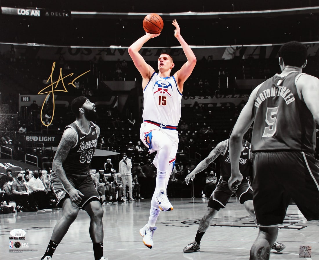 Nikola Jokic Signed 16x20 Denver Nuggets Photo with JSA COA: Nikola Jokic Signed 16x20 Denver Nuggets Photo with JSA COA Capture a moment of basketball greatness with this authentic signed 16x20 horizontal spotlight photo of Nikola Jokic, the star player of the