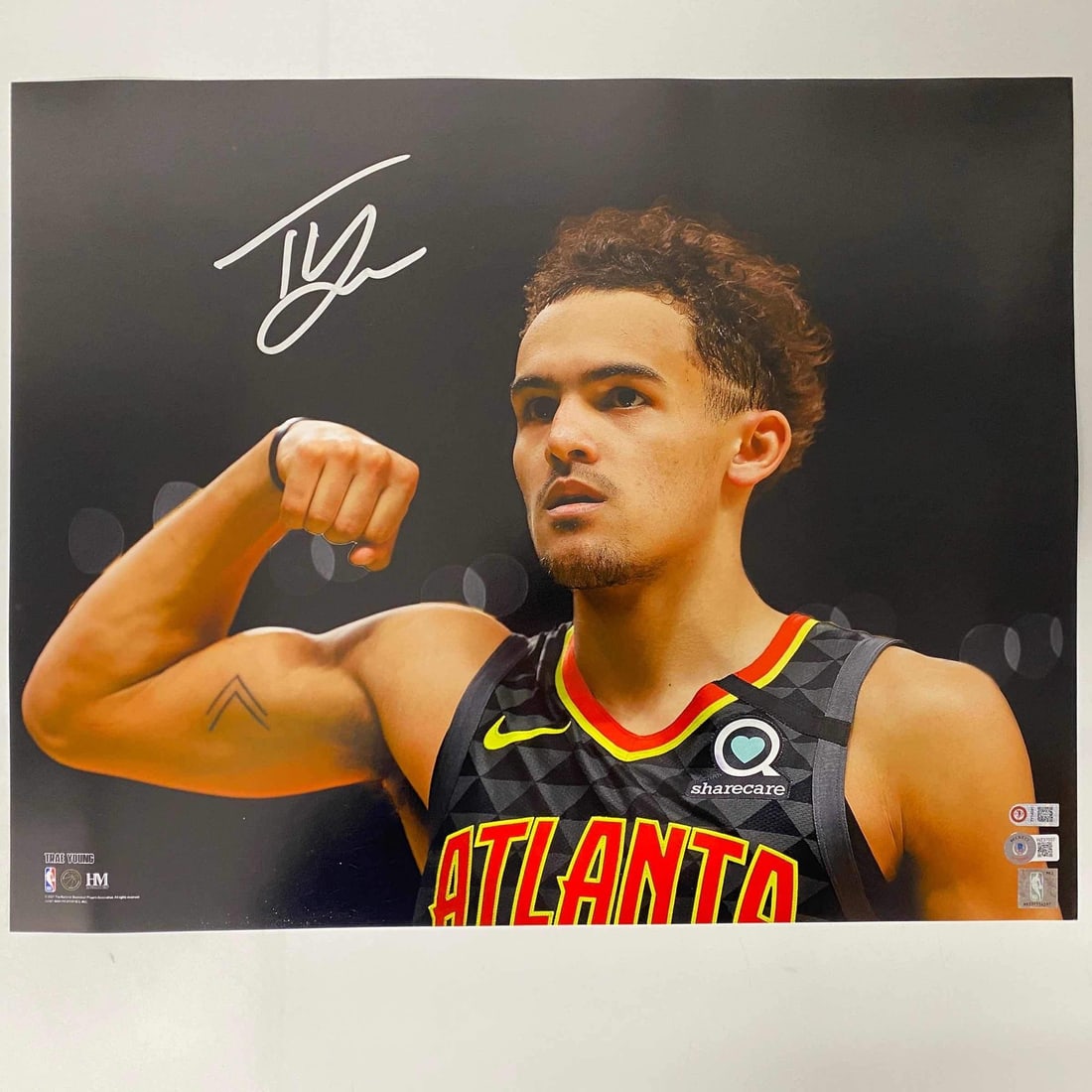 Trae Young Autographed 16x20 Photo Atlanta Hawks Beckett COA: Trae Young Autographed 16x20 Photo Atlanta Hawks Beckett COA Celebrate the talent of Trae Young with this autographed 16x20 photo, capturing him in action as a member of the Atlanta Hawks. This authen