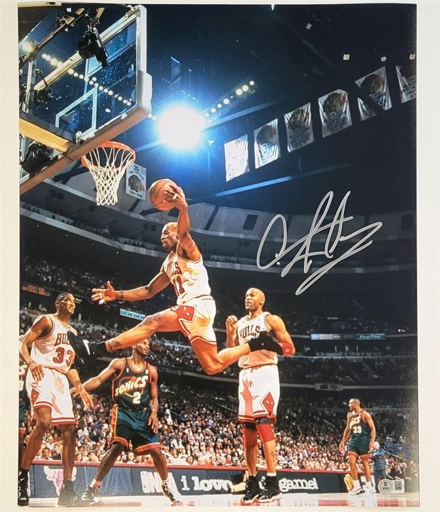 Dennis Rodman Signed 16x20 Bulls Photo Beckett Authenticated: Dennis Rodman Signed 16x20 Bulls Photo Beckett Authenticated This is an original signed 16x20 photo of Dennis Rodman, featuring the Chicago Bulls in action against the Seattle Sonics. The autograph ha