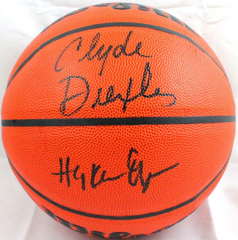 JSA Witnessed Signed Wilson NBA Ball by Drexler and Olajuwon: JSA Witnessed Signed Wilson NBA Ball by Drexler and Olajuwon This Wilson NBA basketball is autographed by Clyde Drexler and Hakeem Olajuwon. The signatures are authenticated by James Spence Authentica