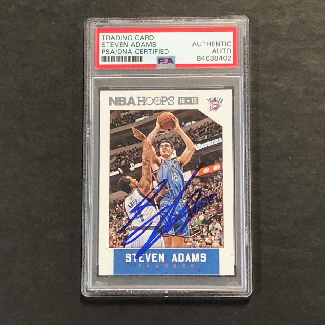 Steven Adams Signed 2015-16 NBA Hoops Card PSA/DNA Encapsulated Thunder: Steven Adams Signed 2015-16 NBA Hoops Card PSA/DNA Encapsulated Thunder This is a 2015-16 NBA Hoops #258 trading card featuring Steven Adams of the Oklahoma City Thunder. The card is signed by Steven 